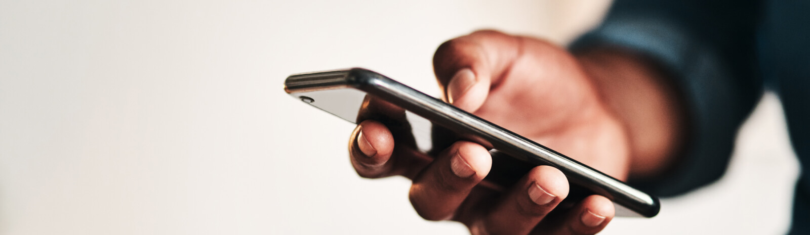 Close up of hand holding a smartphone